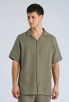 Front image of a model wearing Cotton muslin resort shirt in sage, by brand Lindbergh