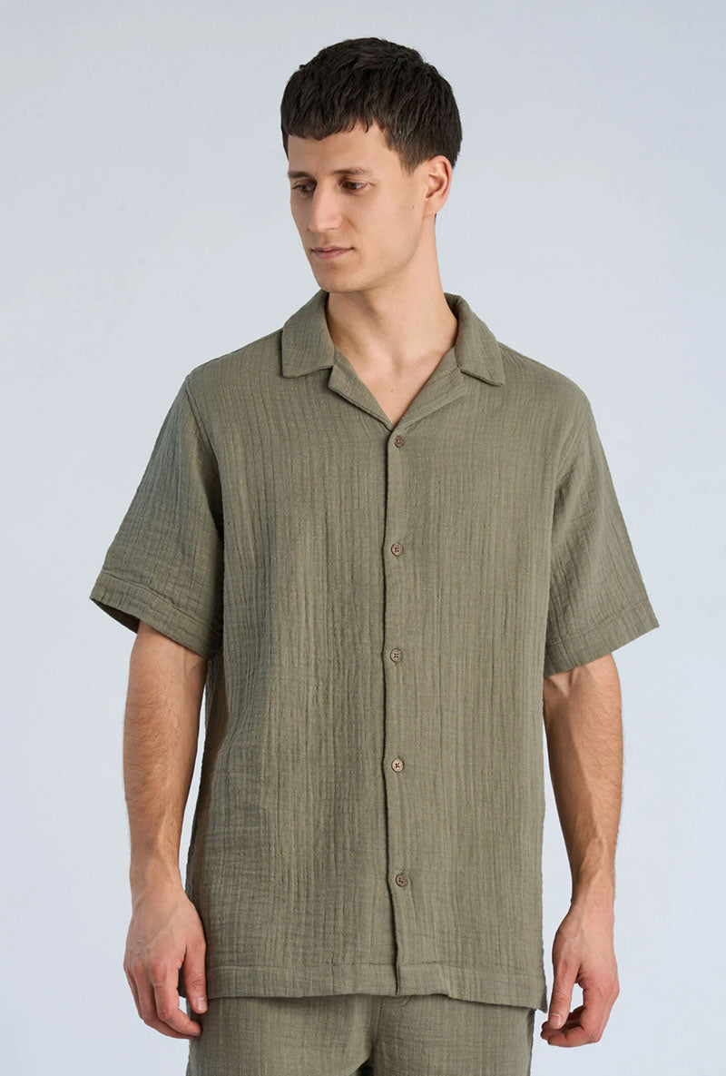 Front image of a model wearing Cotton muslin resort shirt in sage, by brand Lindbergh