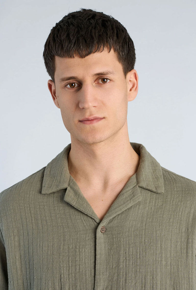Front image of a model wearing Cotton muslin resort shirt in sage, by brand Lindbergh