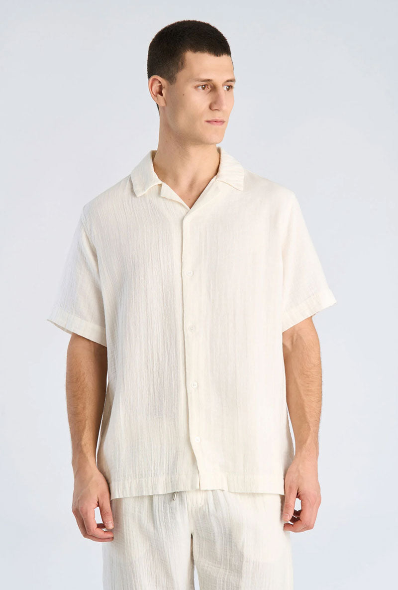 Front image of a model wearing Cotton muslin resort shirt in off white, by brand Lindbergh