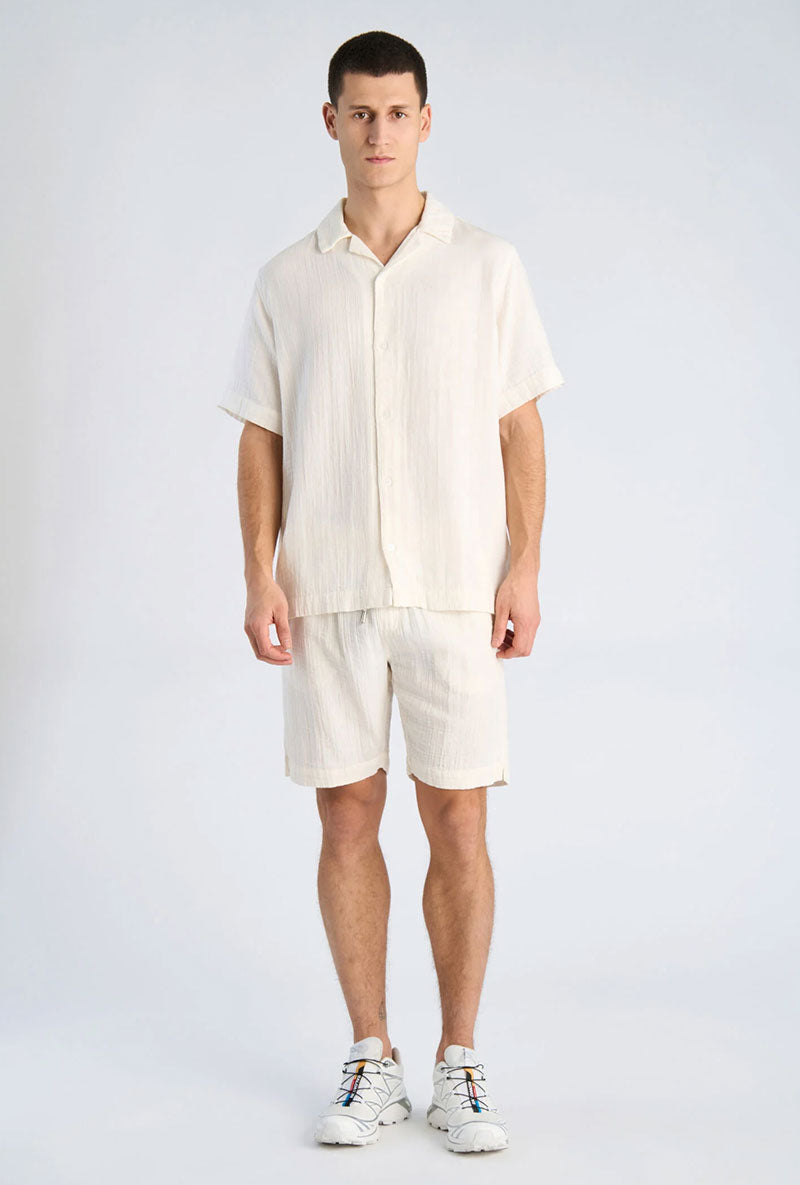 Front image of a model wearing Cotton muslin resort shirt in off white, by brand Lindbergh