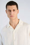 Front image of a model wearing the Cotton muslin resort shirt in off white, by brand Lindbergh