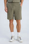 Front image of a model wearing Cotton muslin shorts in sage, by brand Lindbergh