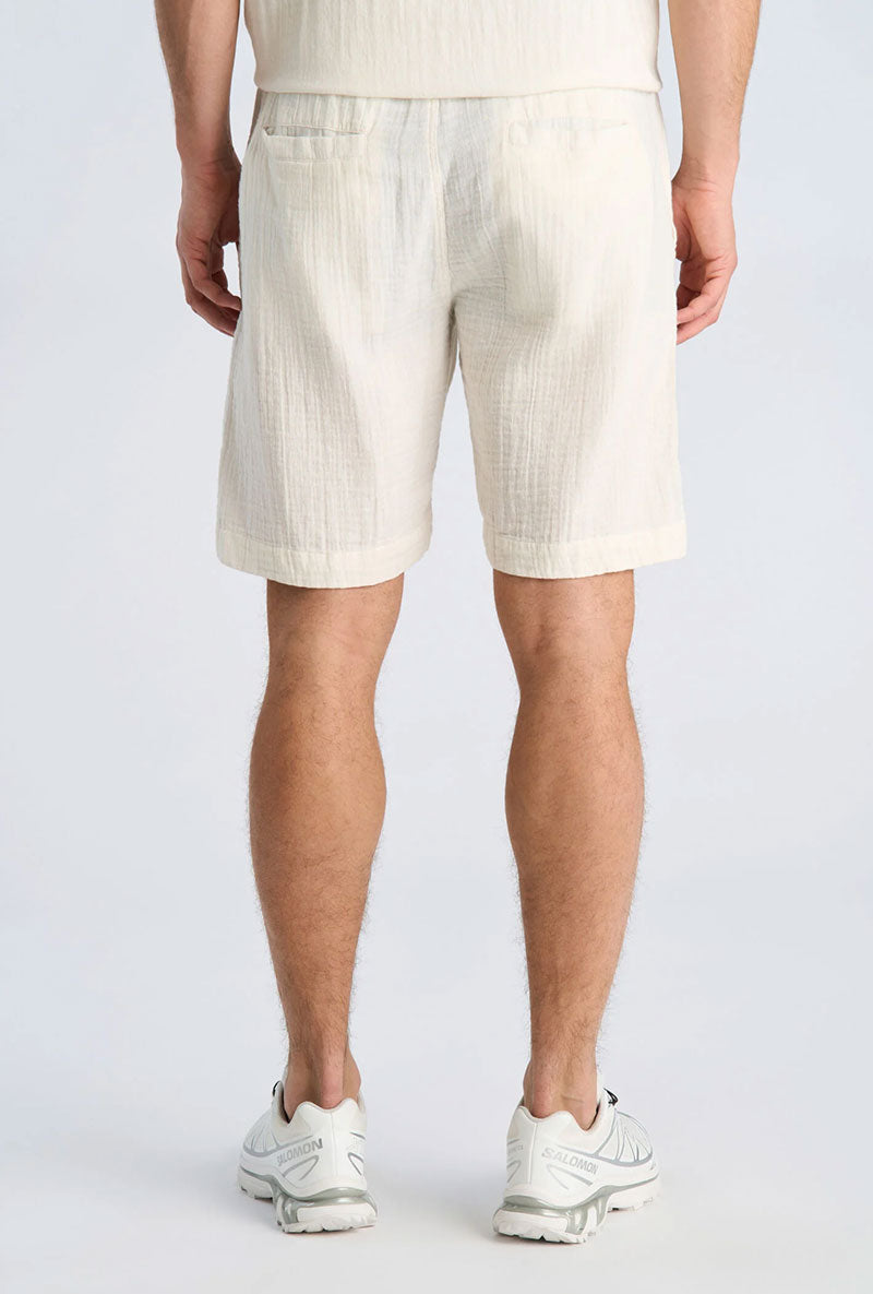 Back image of a model wearing Cotton muslin shorts in off white, by brand Lindbergh