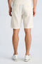 Back image of a model wearing the Cotton muslin shorts in off white, by brand Lindbergh