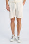 Front image of a model wearing Cotton muslin shorts in off white, by brand Lindbergh