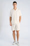 Front image of a model wearing the Cotton muslin shorts in off white, by brand Lindbergh