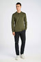Front image of a model wearing the Lindbergh ecovero l/s zip polo in khaki, by brand Lindbergh