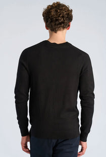 Back image of a model wearing the Ecovero vneck cardigan in black, by brand Lindbergh