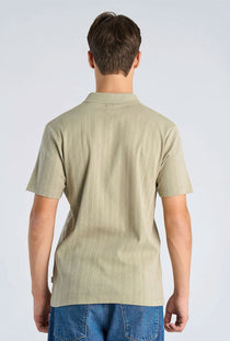 Back image of a model wearing the Jacquard vneck polo in olive, by brand Lindbergh