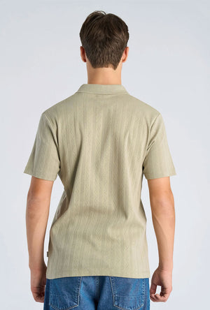 Back image of a model wearing the Jacquard vneck polo in olive, by brand Lindbergh