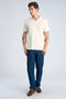 Front image of a model wearing the Jacquard vneck polo in off white, by brand Lindbergh