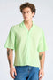 Front image of a model wearing Linen blend cropped shirt in green, by brand Lindbergh
