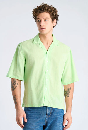 Front image of a model wearing the Linen blend cropped shirt in green, by brand Lindbergh