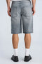 Back image of a model wearing the Loose fit denim shorts in grey, by brand Lindbergh
