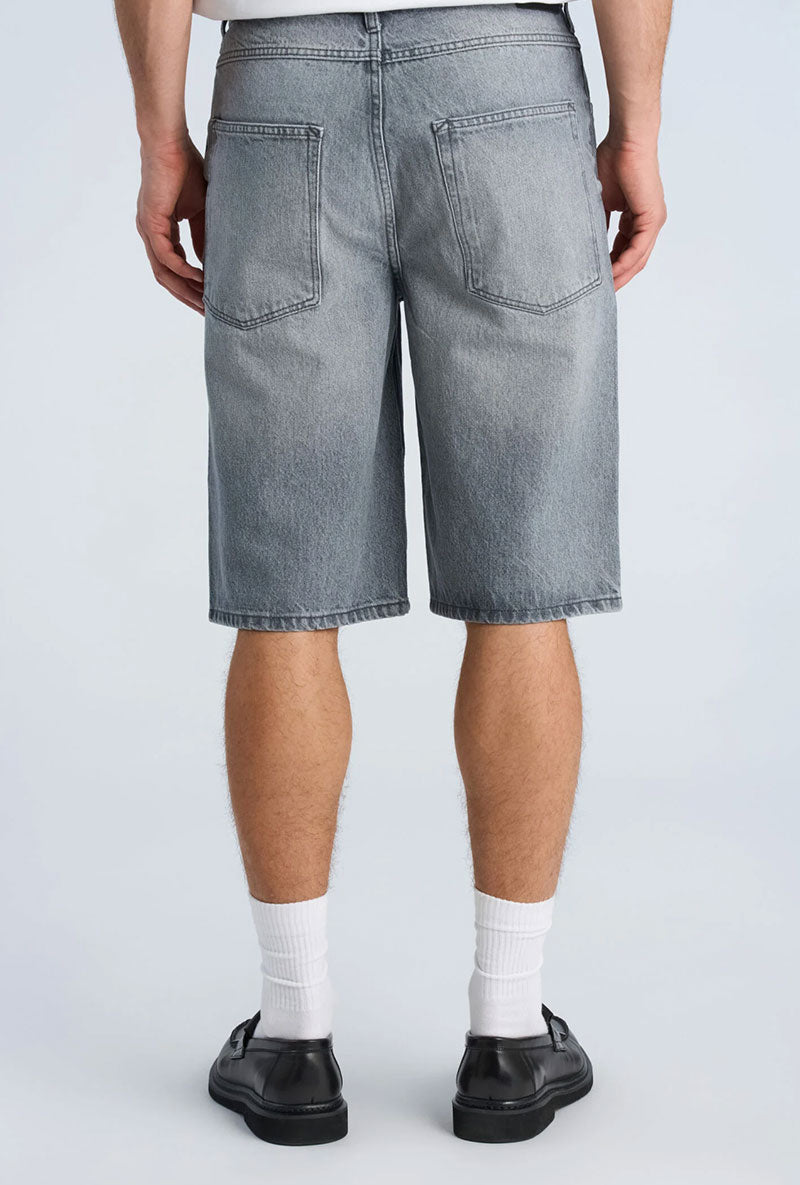 Back image of a model wearing Loose fit denim shorts in grey, by brand Lindbergh