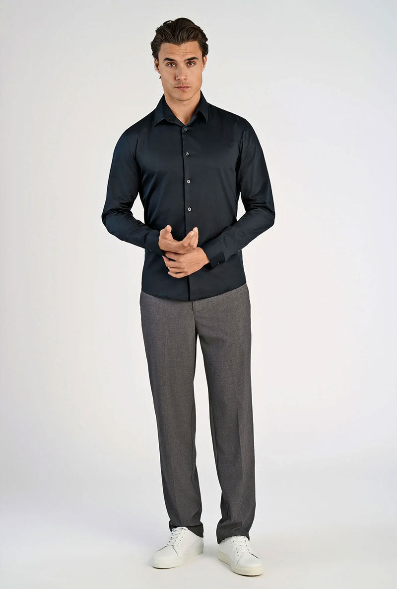 Front image of a model wearing Plain sateen superlflex shirt in black, by brand Lindbergh