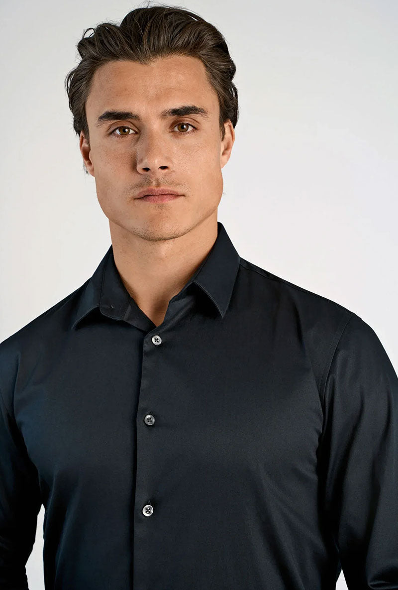 Front image of a model wearing Plain sateen superlflex shirt in black, by brand Lindbergh