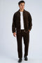 Front image of a model wearing the Seersucker corduroy zip jacket in brown, by brand Lindbergh