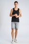 Front image of a model wearing the Slim fit tank top in black, by brand Lindbergh