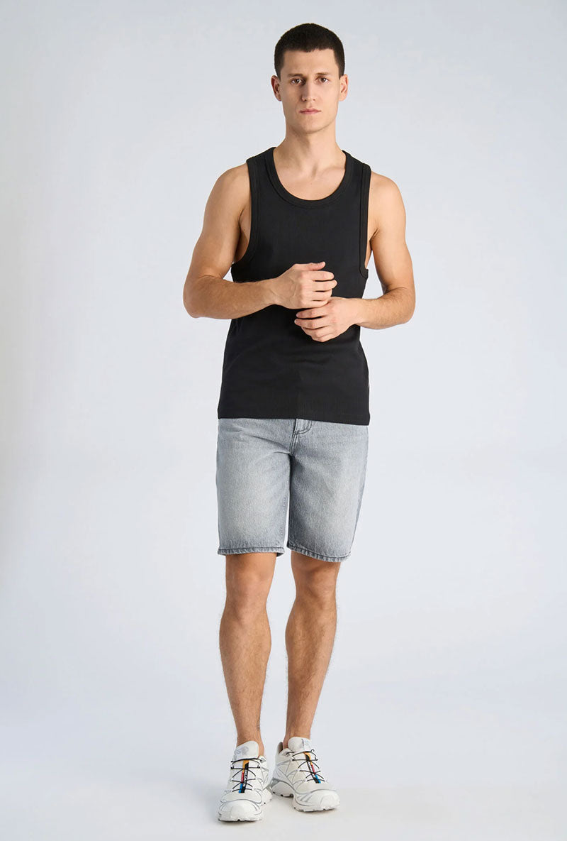 Front image of a model wearing Slim fit tank top in black, by brand Lindbergh