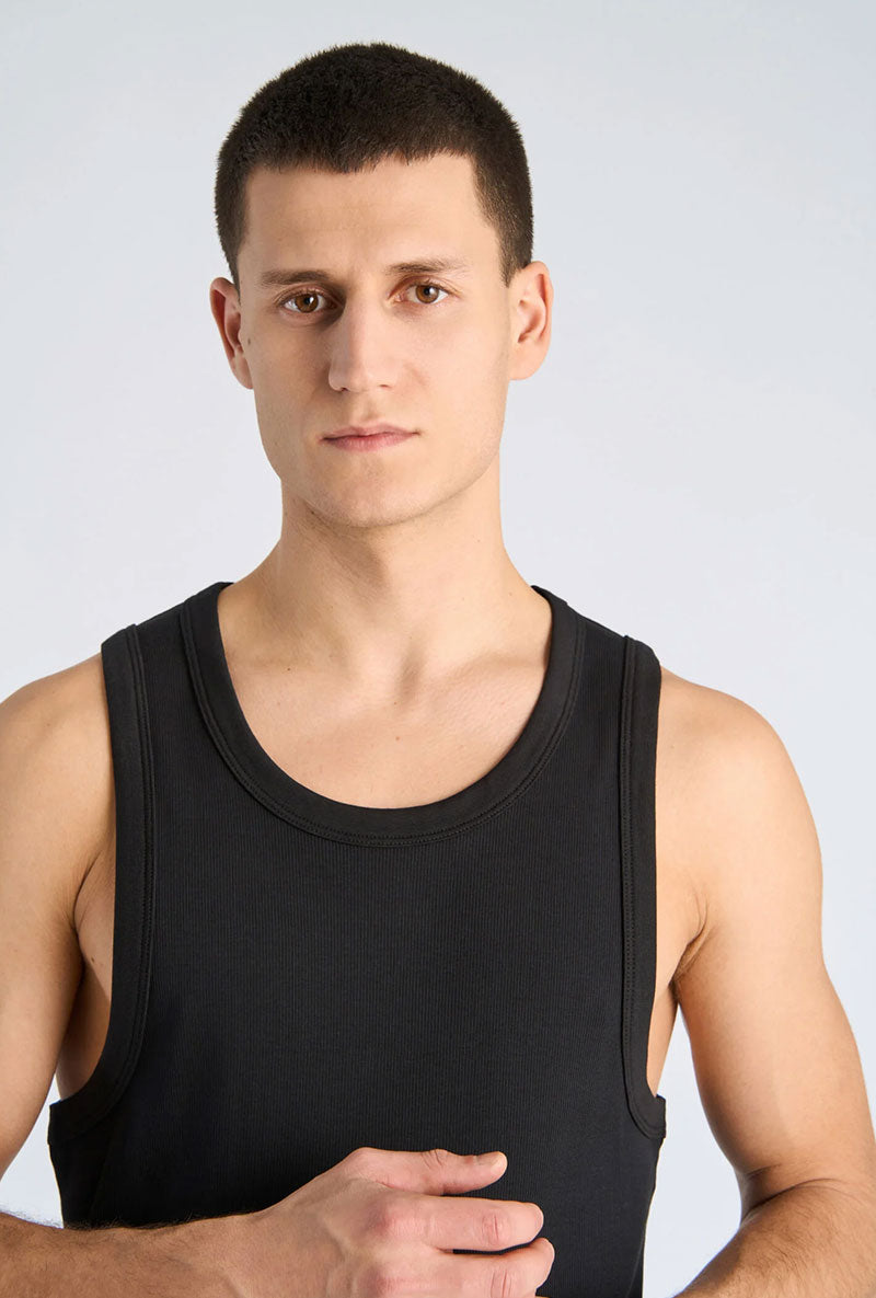 Front image of a model wearing Slim fit tank top in black, by brand Lindbergh