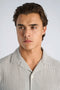 Front image of a model wearing the Striped seersucker shirt in stripe, by brand Lindbergh