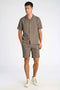 Front image of a model wearing the Textured shorts in khaki, by brand Lindbergh