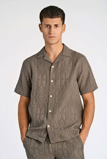 Front image of a model wearing the Textured ss shirt in khaki, by brand Lindbergh