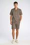 Front image of a model wearing the Textured ss shirt in khaki, by brand Lindbergh