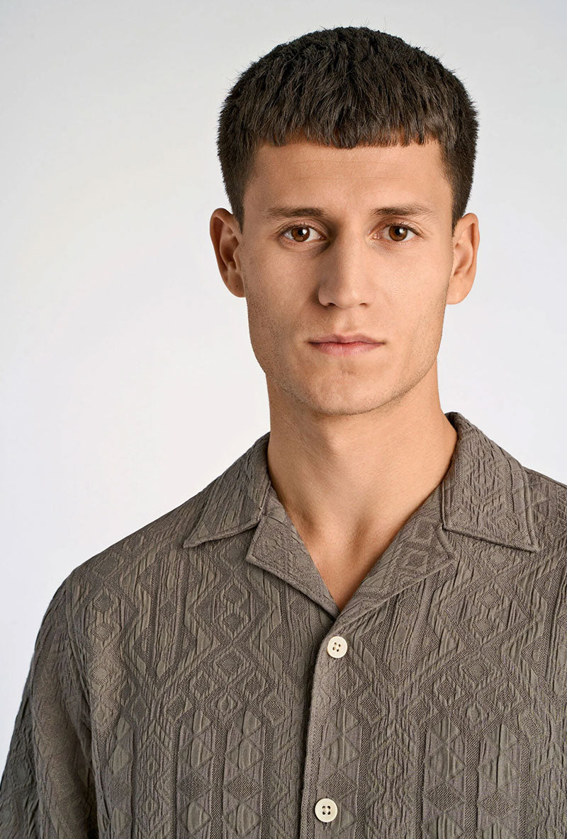 Front image of a model wearing Textured ss shirt in khaki, by brand Lindbergh