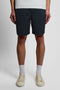 Front image of a model wearing Everyday shorts in navy, by brand Lyle and scott