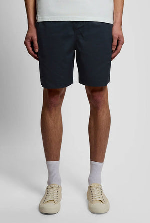 Front image of a model wearing the Everyday shorts in navy, by brand Lyle and scott