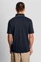 Back image of a model wearing the Fine tipped polo in navy, by brand Lyle and scott