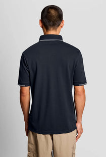 Back image of a model wearing the Fine tipped polo in navy, by brand Lyle and scott