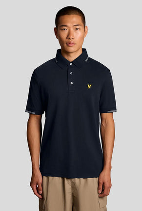 Front image of a model wearing Fine tipped polo in navy, by brand Lyle and scott