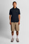 Front image of a model wearing the Fine tipped polo in navy, by brand Lyle and scott