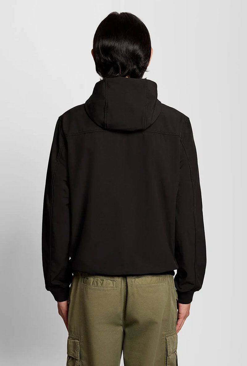 Back image of a model wearing Fleece back softshell jacket in black, by brand Lyle and scott