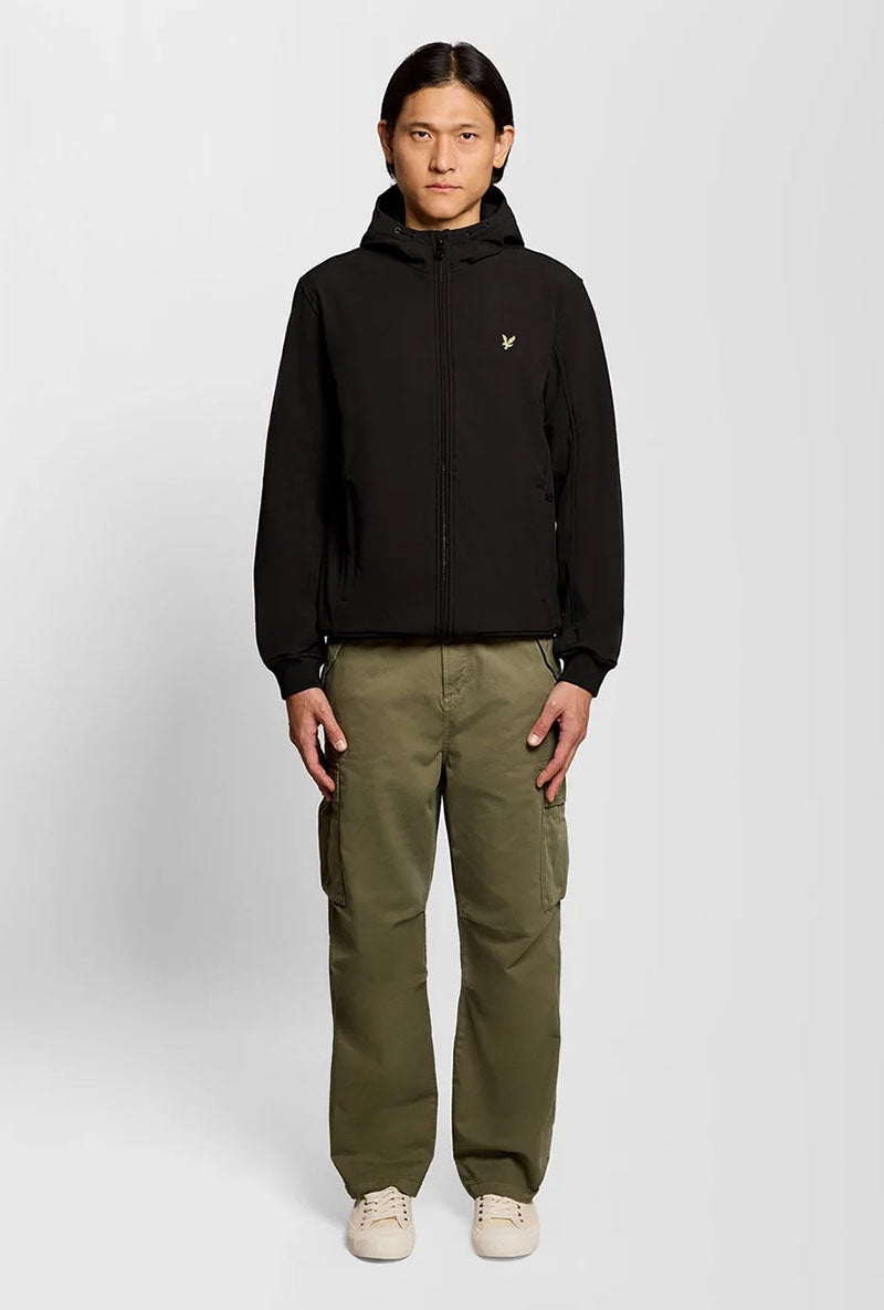 Front image of a model wearing Fleece back softshell jacket in black, by brand Lyle and scott