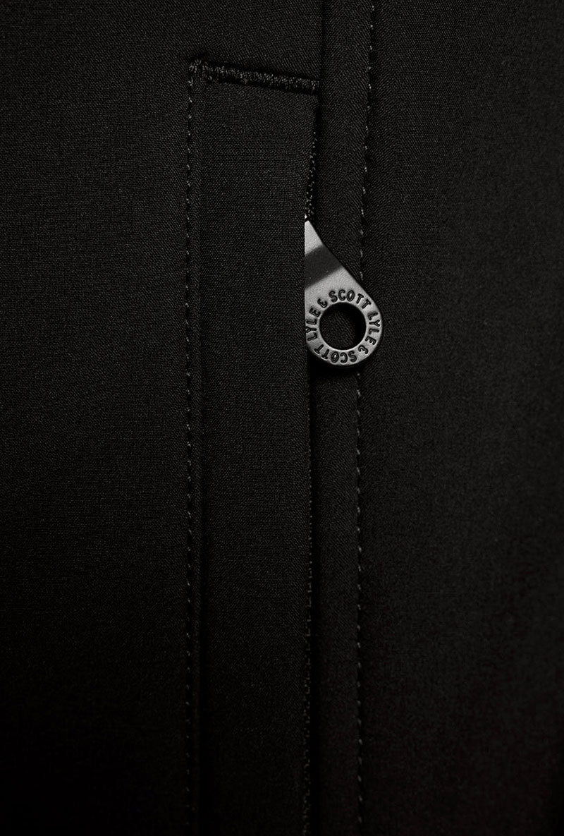 Front image of a model wearing Fleece back softshell jacket in black, by brand Lyle and scott