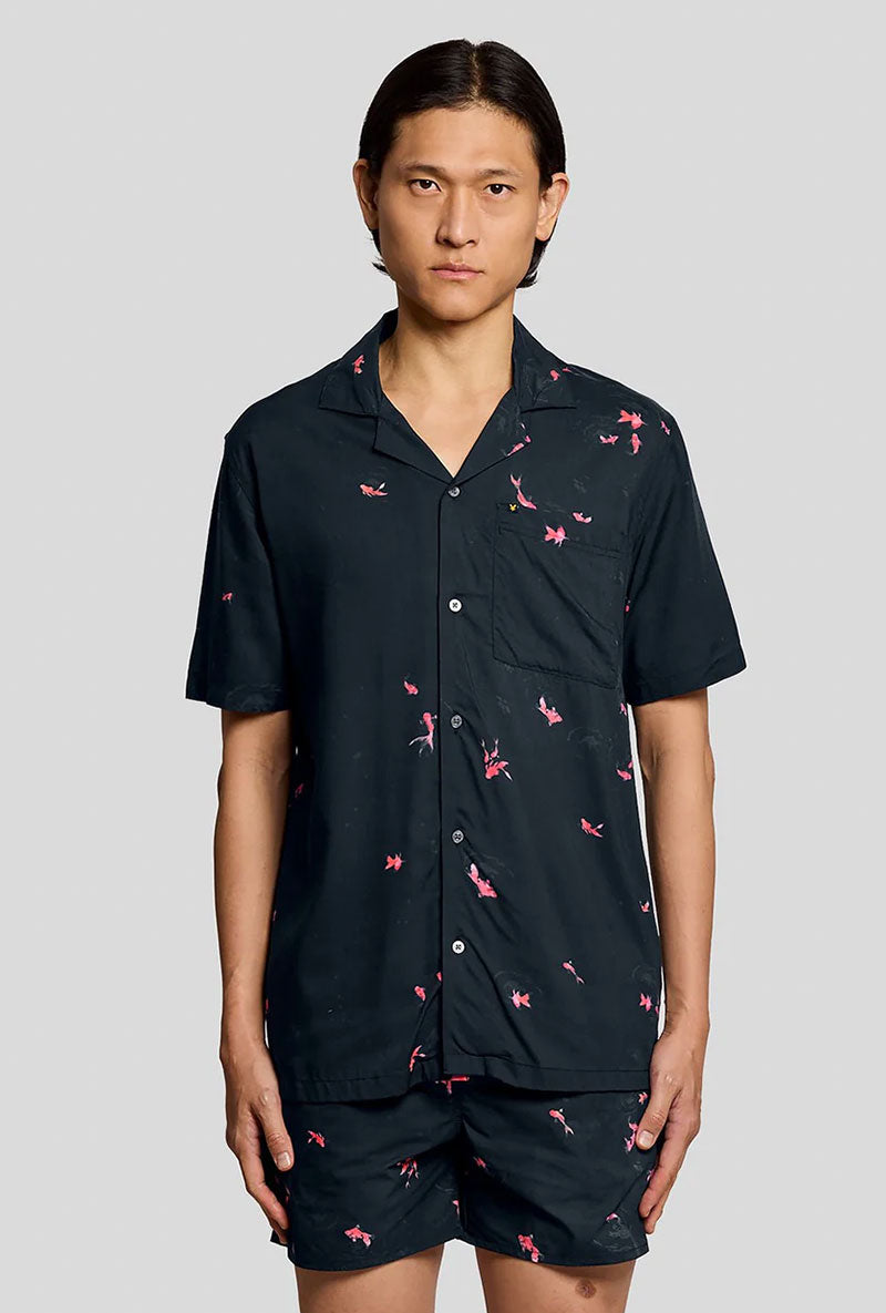 Front image of a model wearing Goldfish resort shirt in navy, by brand Lyle and scott