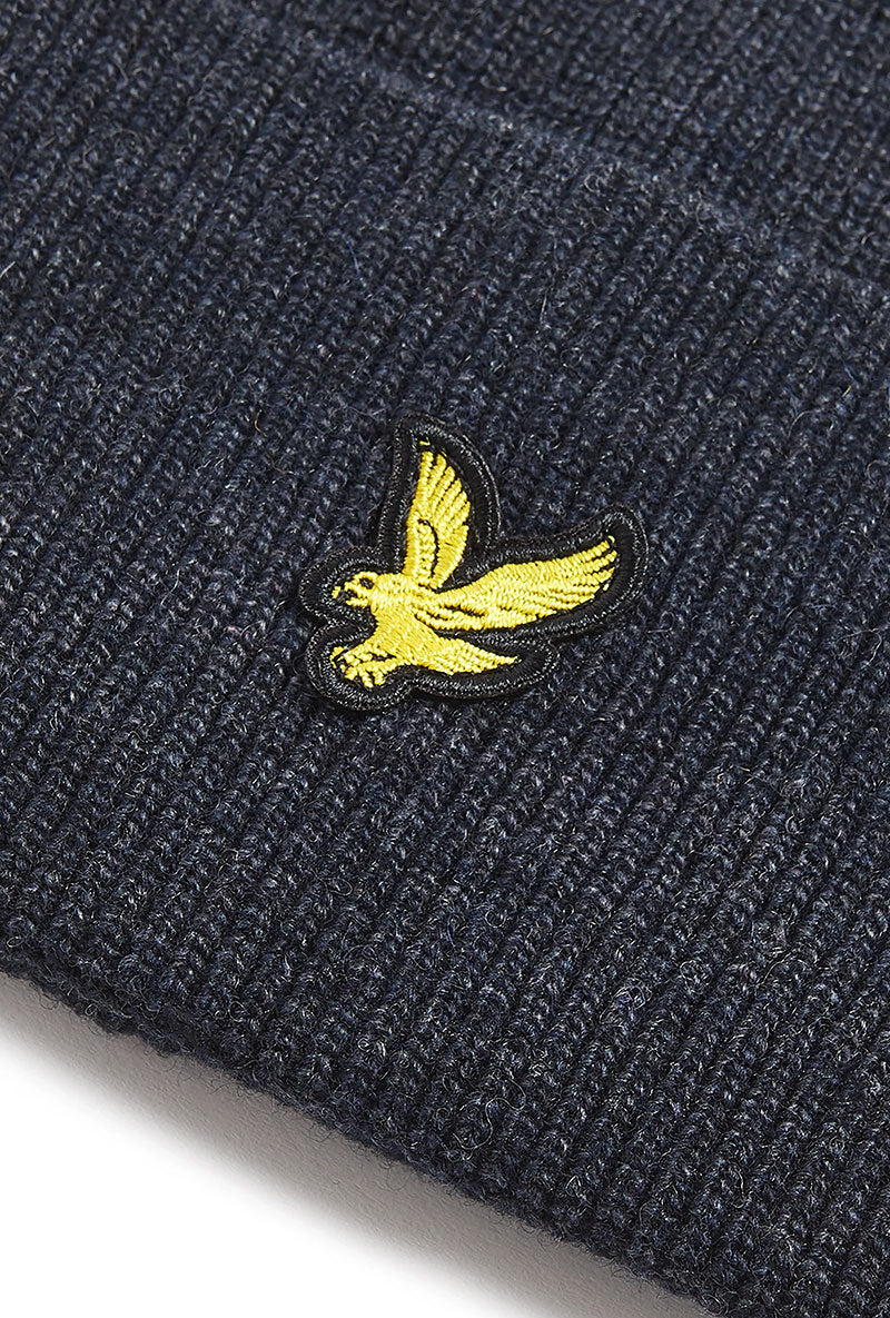 Logo detail image of Lyle and scott lambswool ribbed beanie in navy, by brand Lyle and scott