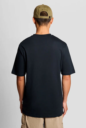Back image of a model wearing the Lyles laundry graphic t in navy, by brand Lyle and scott