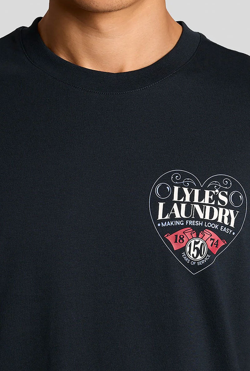 Front image of a model wearing Lyles laundry graphic t in navy, by brand Lyle and scott