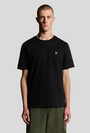 Front image of a model wearing the Plain logo tshirt in black, by brand Lyle and scott
