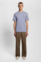 Front image of a model wearing the Plain logo tshirt in blue, by brand Lyle and scott