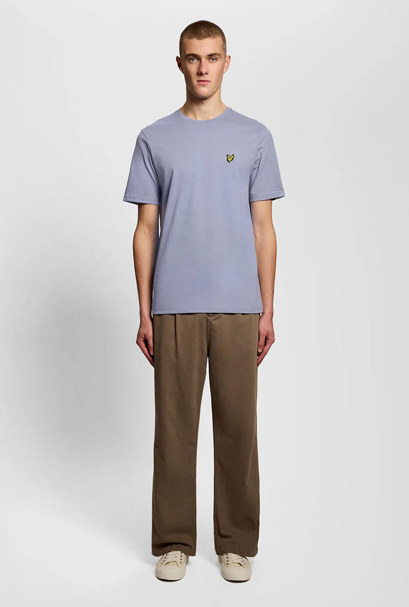 Front image of a model wearing Plain logo tshirt in blue, by brand Lyle and scott