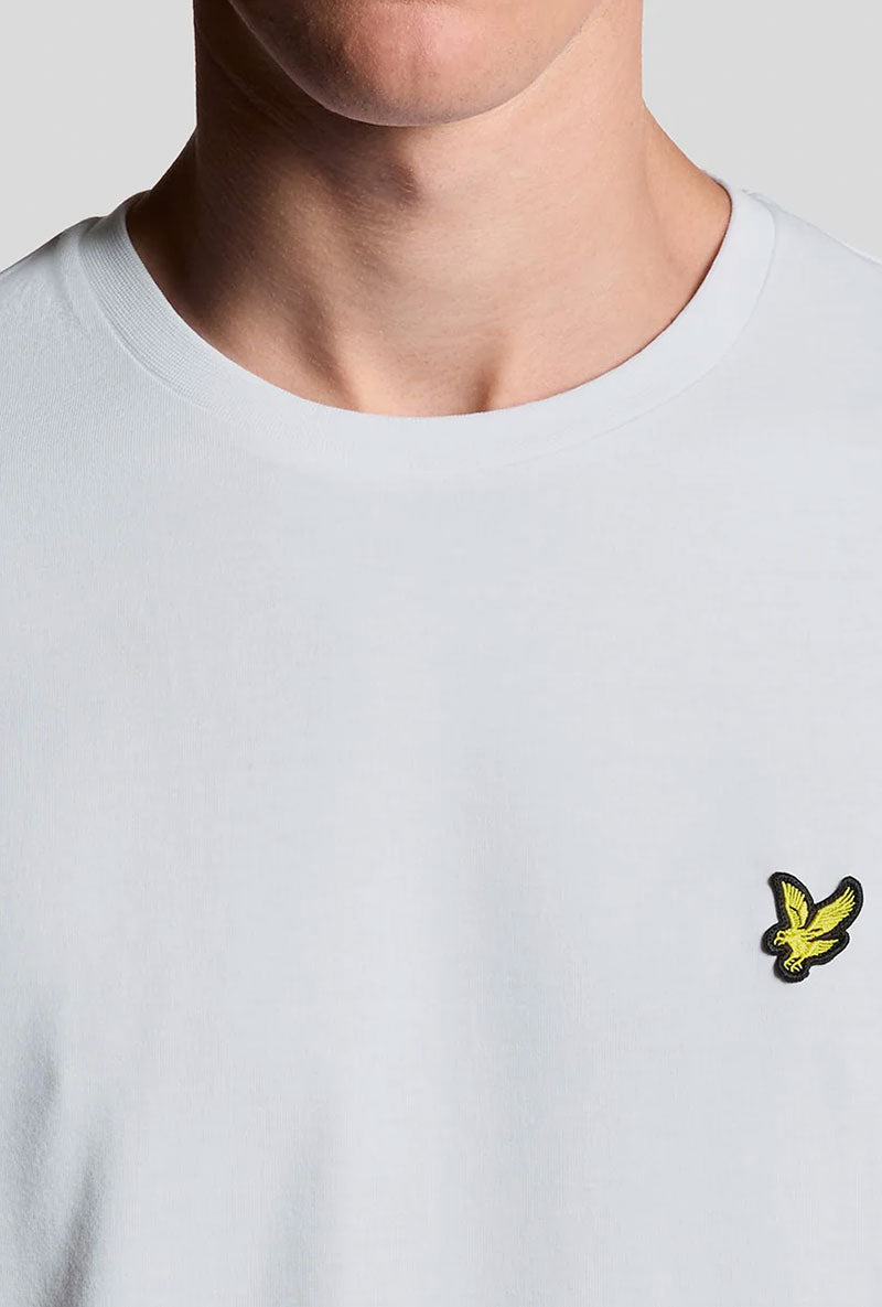 Front neck detail image of a model wearing Plain logo tshirt in white, by brand Lyle and scott
