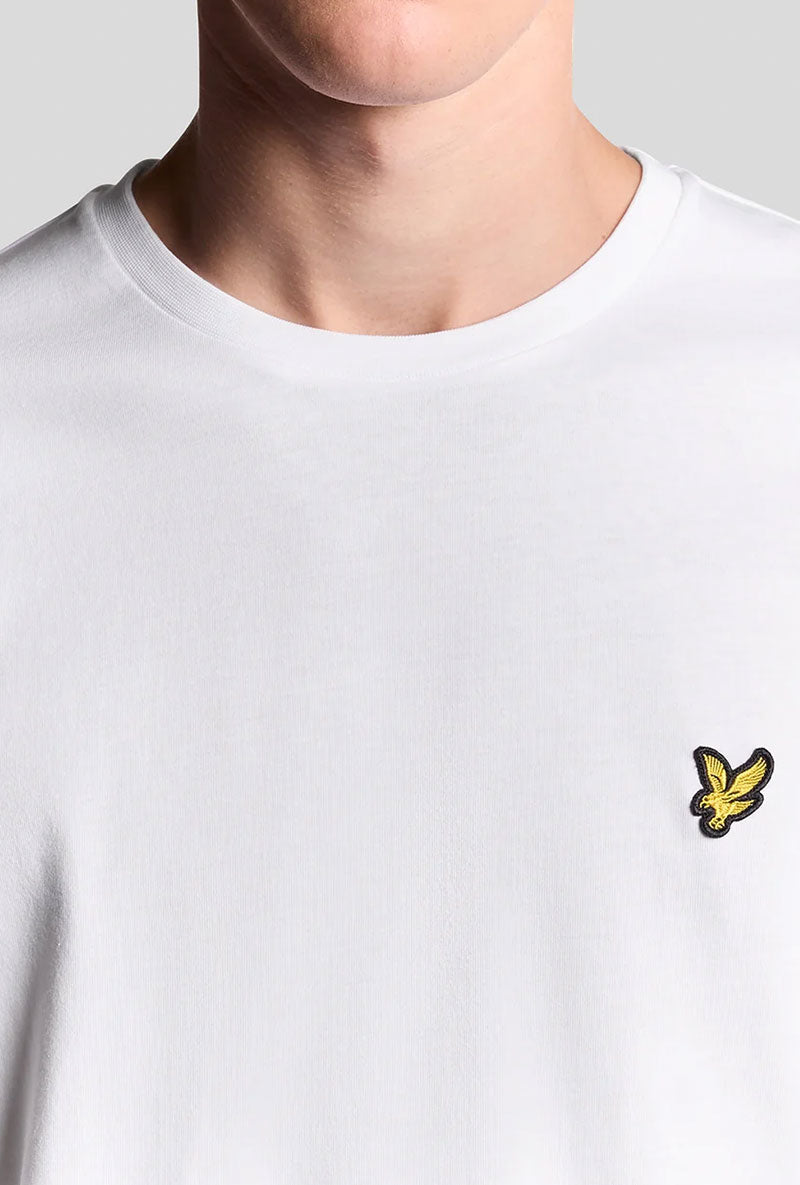 Front image of a model wearing Plain ls tshirt in white, by brand Lyle and scott