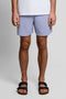 Front image of a model wearing Plain swimshorts in blue, by brand Lyle and scott
